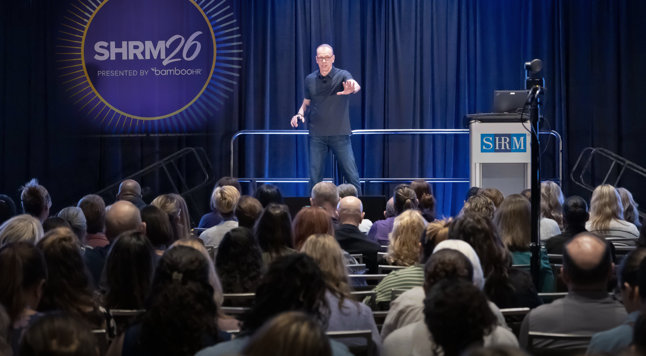 Michael Puck speaking to a conference audience