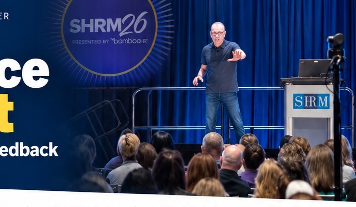 Michael Puck speaking to a conference audience
